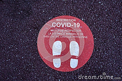 Footprint floor sticker, foot steps in circle, keep distance waiting in line, stand here sign, coronavirus or Covid-19 Stock Photo