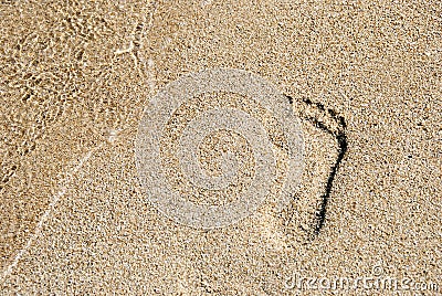 Footprint in golden sand Stock Photo