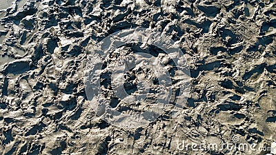 Footprint or imprint shoe in the mud.Mud texture or wet brown soil as natural organic clay and geological sediment Stock Photo