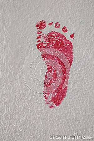 Footprint painted on the wall Stock Photo