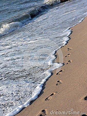 Footprints on the beach Stock Photo