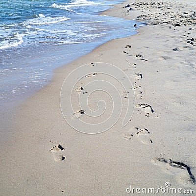 Footprints on the beach near Rewal in Poland Stock Photo