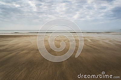 Footprints on beach Summer sunset landscape Stock Photo