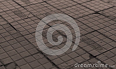 Ocd footprints on urban tiles Stock Photo