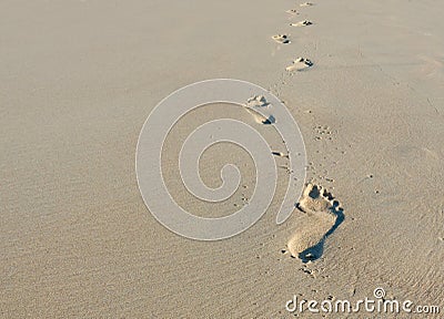 Footprints in sand Stock Photo