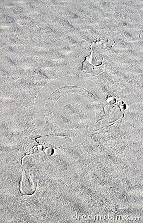 Footprints on white sand Stock Photo