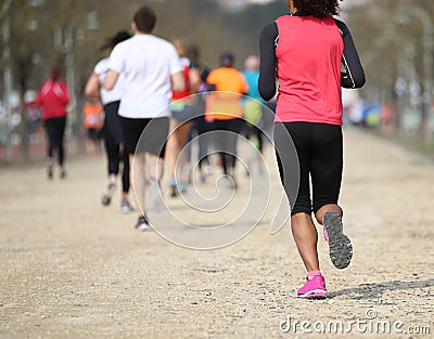 footrace with many athletes and an young african girl Editorial Stock Photo