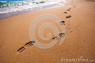 Footsteps on the beach Stock Photo