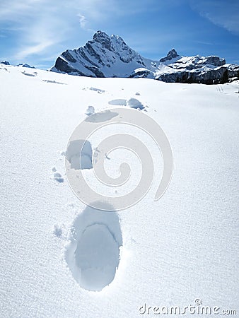 Footsteps on the snow Stock Photo