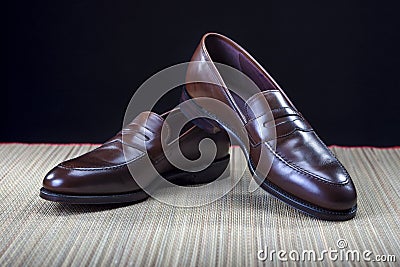 Footwear Concepts and Ideas. Pair of Stylish Expensive Modern Calf Leather Brown Penny Loafers Shoes Stock Photo