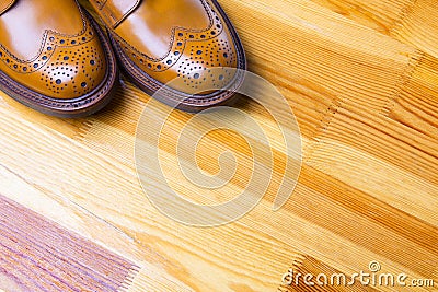 Footwear Ideas. Closeup of Tips of Male`s Brogues Boots in Tan Co Stock Photo