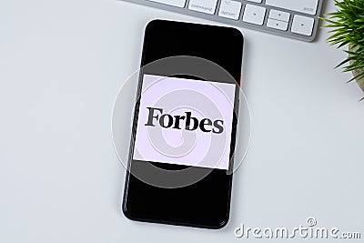 Forbes Magazine app logo on a smartphone screen. Editorial Stock Photo