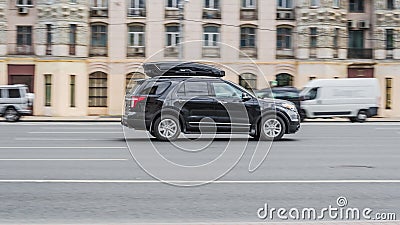 Ford Explorer SUV vehicle on the city road. Fast moving black car on Moscow streets. Accelerating with low-emission. Compliance Editorial Stock Photo