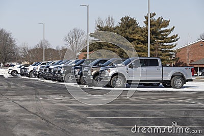 Ford F-250 display at a dealership in snow. The Ford F250 is available in XL, XLT, Lariat, King Ranch, and Platinum models Editorial Stock Photo