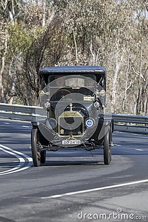 1915 Ford model T Tourer driving on country road Editorial Stock Photo