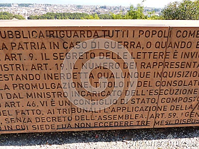 Lettering wall of the Italian Constitution with behind the panorama of Rome in Italy. Editorial Stock Photo