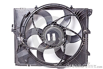 Foreground of a metal car spare part - engine radiator cooling fan on a white isolated background. Auto repair in the workshop Stock Photo