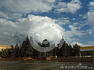 In the foreground is revolution square in Chelyabinsk, as well as signs of thunderstorm activity in the form of Cumulus clouds. Editorial Stock Photo
