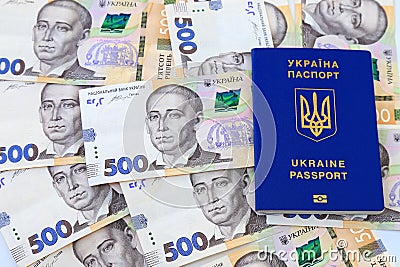 Foreign biometric passport with inscription in Ukrainian - Passport Ukraine, with new banknotes 500 hryvnia. Concept of money, Stock Photo