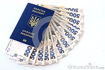 Foreign biometric passport with inscription in Ukrainian - Passport Ukraine, with new banknotes 500 hryvnia. Concept of money, Stock Photo