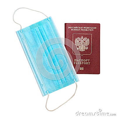 Foreign passport and protective medical mask on white background Stock Photo