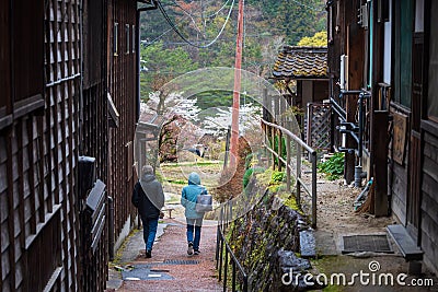 foreign tourist couple visit Tsumago juku, Kiso valley Editorial Stock Photo