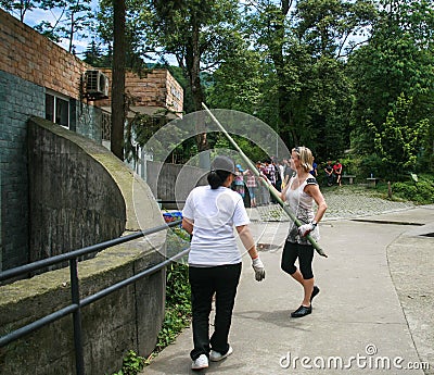 Foreign volunteer in yaan bifengxia base of ccpccp in china Editorial Stock Photo