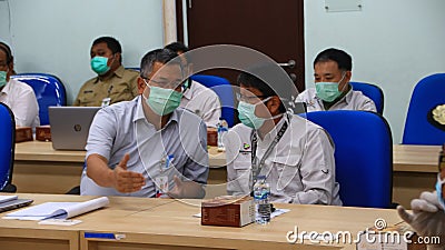 Foreign workers when examined by officers related to corona virus or Covid 19 Editorial Stock Photo