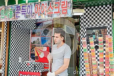 A foreigner selling ice cream in Insa-dong, Korea Editorial Stock Photo