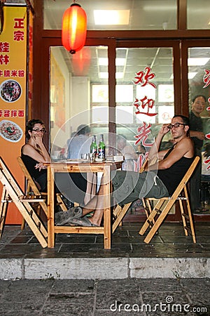 The foreigners in the restaurant in guilin, china Editorial Stock Photo