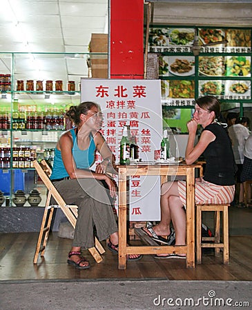 The foreigners in the restaurant in guilin, china Editorial Stock Photo