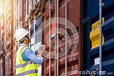 Foreman control loading Containers box from Cargo Stock Photo