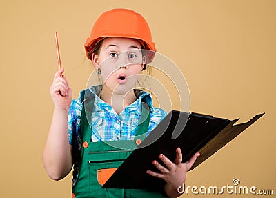 Foreman planning. Builder engineer architect. Future profession. Kid builder girl. Build your future yourself Stock Photo