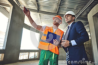 Project manager is communicating with worker man Stock Photo