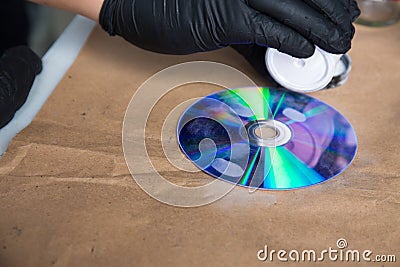 Forensic hand in glove brushing for search latent fingerprints e Stock Photo