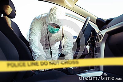 Forensic Science. Criminologist investigates a crime scene. Stock Photo