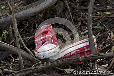 Forensics and investigation kid shoes in the forest Stock Photo