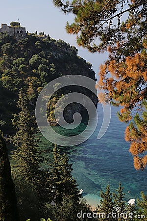 Forest and castle around Valtos beach in Parga Stock Photo