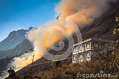 Forest fire burning on a hill in the Lachung, Sikkim India. Stock Photo