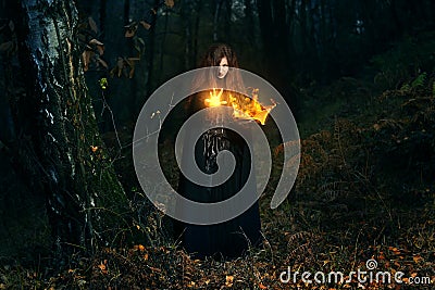 Forest keeper casting fire magic Stock Photo