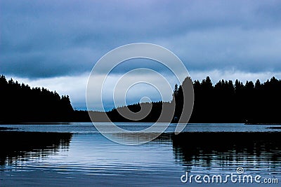 Forest landscape, the lake and forest, twilight in the woods, forest beach, blue sky and lake, forest reflection in water Stock Photo