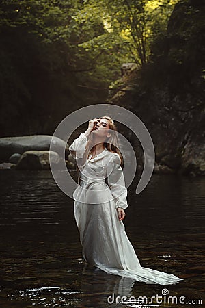 Forest maiden in mystical waters Stock Photo