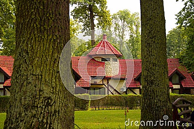 Forest residence hotel apartment cottage landmark object outdoor scenic between two trees Stock Photo