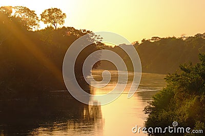 Forested shores of the Aquidauana river in the brazilian Pantanal at sunset, Aquidauana, Mato Grosso Do Sul, Brazil Stock Photo