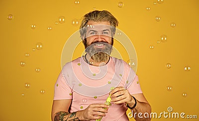 Forever young guy. Positive. Carefree man soap bubbles. Summer vacation. Infantility concept. Happy playful bearded Stock Photo