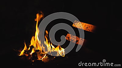 Forge fire in furnace. Blacksmith tempers a steel product in a stove. Smithy forging for hardening and heating iron Stock Photo