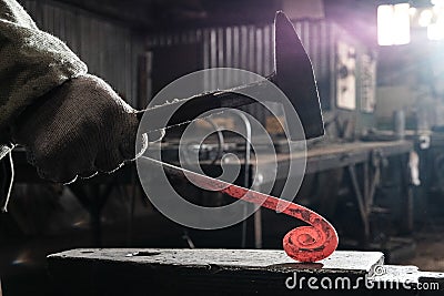 Forge, production workshop. Blacksmith tools and hot metal. Stock Photo