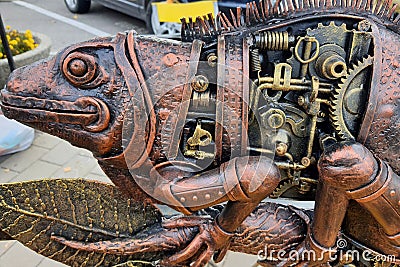 A forged metal figurine, funny unusual iron iguana are presented at Koval fest exhibition. Art object sculpture decorative metal Editorial Stock Photo