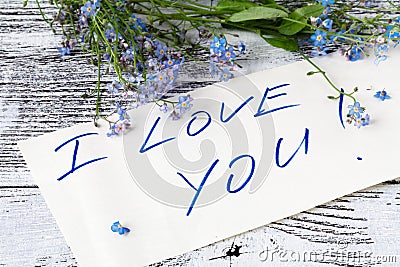 Forget-me-not flower on anÐ² love note Stock Photo