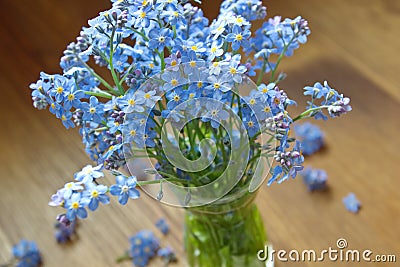 Forget me nots in the green vase Stock Photo